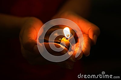 Oil lamp in hands Stock Photo