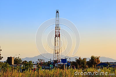 Oil Land Drilling Rig Working In The Field Stock Photo