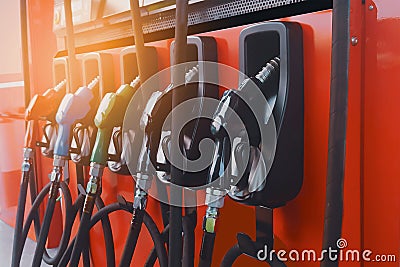 Oil nozzle or fuel injector and fuel dispenser, in pump station,consisting of petrol,diesel,ethanol and gasohol,energy and Stock Photo