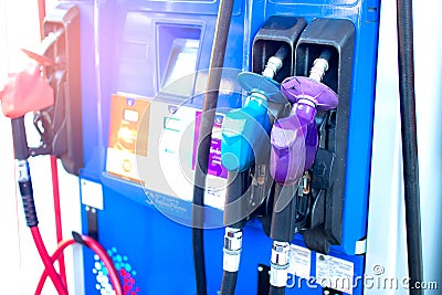 Oil nozzle or fuel injector and fuel dispenser, in pump station,consisting of petrol,diesel,ethanol and gasohol,energy and Stock Photo