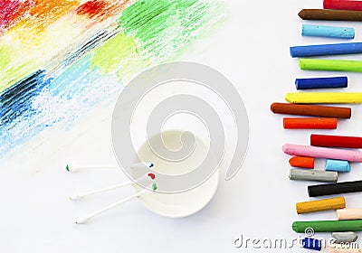 Oil pastels crayons colorful art drawing and cotton bud on white Stock Photo