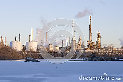 Oil and Petroleum Refinery Along Frozen Mississippi River Stock Photo
