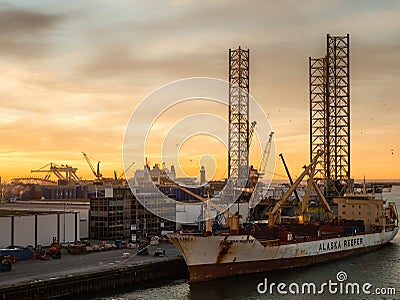 Oil platform Atlantic and cargo ship Chilean Reefer in the port of IJmuiden Editorial Stock Photo