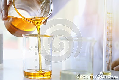 Oil pouring, Equipment and science experiments, Formulating the chemical for medicine Stock Photo