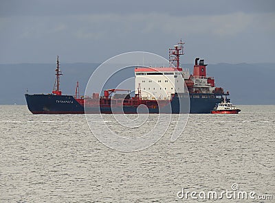 Vladivostok, Primorsky kray / Russia - September 23 2018: Oil product tanker Taganroga at anchor and pilot boat in roadstead of po Editorial Stock Photo