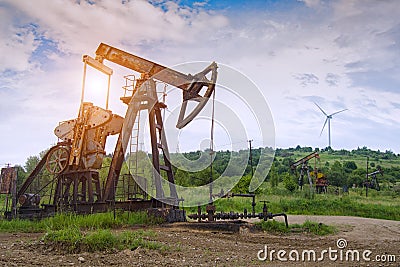 Oil pump on sunrise Stock Photo