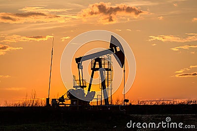 Oil pump in sunset Stock Photo