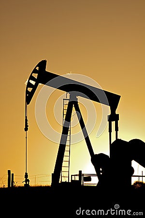 Oil Pumpjack in Sunset Stock Photo