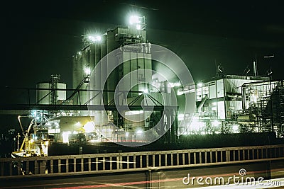 Oil refinery in Mannheim, Germany, europe petrochemical industry night scene scrap metal vintage Stock Photo