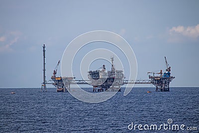 Oil refinery platform at the open sea, producing black gold Editorial Stock Photo