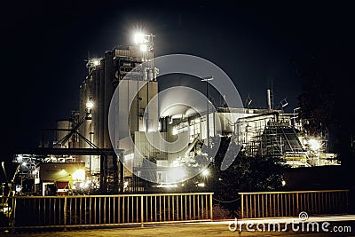 Oil refinery with water vapor in Mannheim, Germany, europe petrochemical industry night scene scrap metal vintage Stock Photo