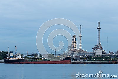 Oil tank ship over petrol refinery background Stock Photo