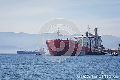 Oil tanker at a tank storage facility Stock Photo