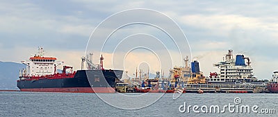 Oil tankers at a tank storage facility, Greece. Stock Photo