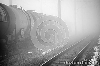Liquid train tank and a empty train rail Stock Photo