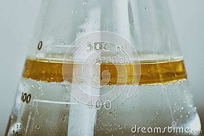 Oil in water emulsions, Oil mixing in liquid phase, Science laboratory, Chemical substance in cylinder, Medical formulating Stock Photo