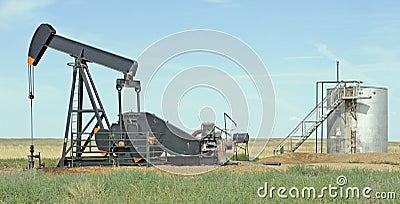 Oil well and tank Stock Photo