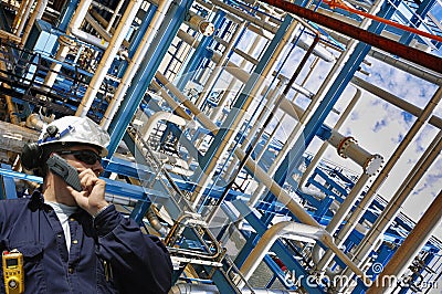 Oil worker with pipelines constructions Stock Photo