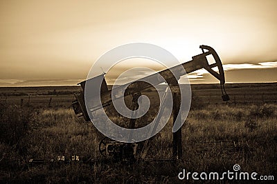 Oilfield Pump Jack at Sunset Stock Photo
