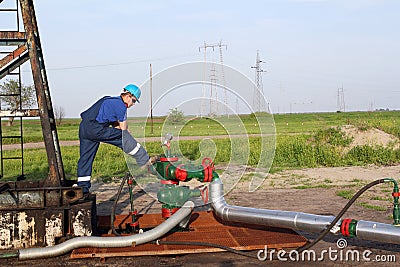 Oilfield with worker Stock Photo