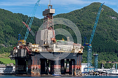 Oilplatform inside the Norwegian fjord for maintance at ships yard Editorial Stock Photo