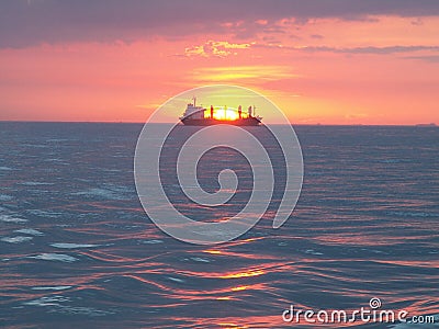 Oiltanker at sea during sunset Stock Photo