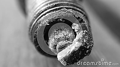 Oily and charred car sparkplug macro photo monochrome Stock Photo