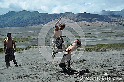 Ojung is the art of fighting the Madurese with rattan blades-fighter expert Ojung is performing on Mount Bromo in East Java 2019 Editorial Stock Photo