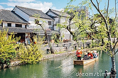 Old boat on canal at Kurashiki Bikan Historical Quarter in Okayama, Japan Editorial Stock Photo