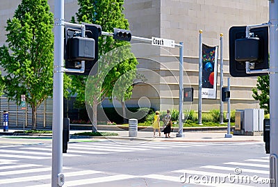 Two white ladies walking in a downtown setting Editorial Stock Photo