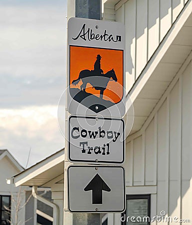 A sign to The Cowboy Trail, a narrow band of mixed forests and grasslands, a wide variety Editorial Stock Photo