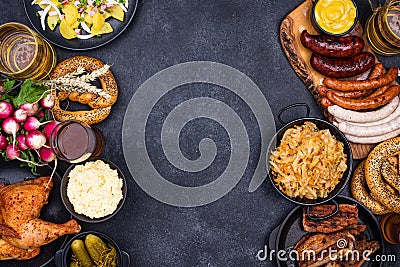 Oktoberfest dishes with beer, pretzel and sausage Stock Photo