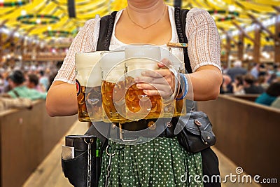 Oktoberfest, Munich. Waiter serve beer, close up. Octoberfest German festival Stock Photo