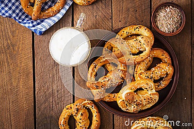 Oktoberfest salted soft pretzels in a bowl and beer Stock Photo