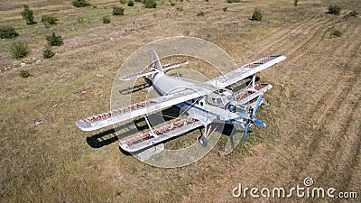 Old abandoned airplane on the field. Top view Stock Photo