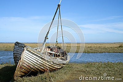 Old abandoned boat on the salt marsh. Stock Photo