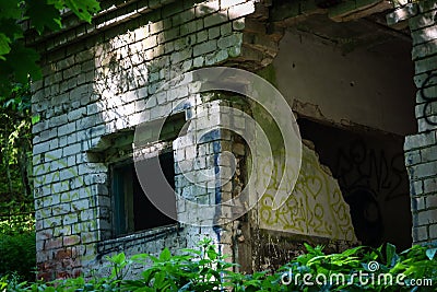 Old abandoned white brick building with squared window holes Editorial Stock Photo