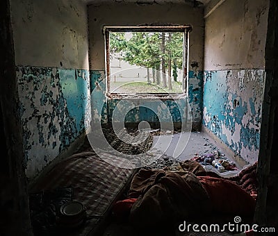 Old, abandoned building inhabited by homeless people Stock Photo