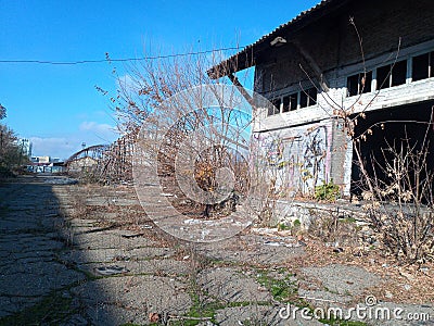 Old abandoned buildings with graffiti on walls. Urban ghetto. Stock Photo