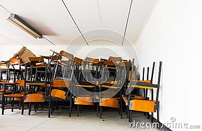 Old abandoned chair in the school. Stock Photo