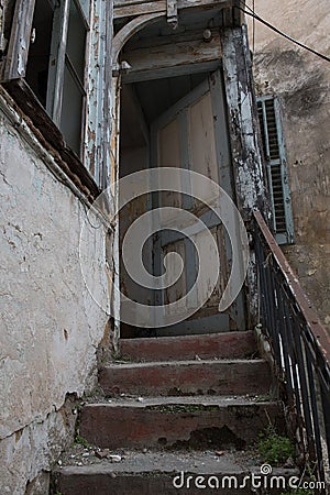 Old abandoned damaged and deserted house staircase Stock Photo