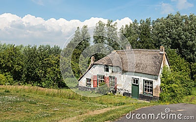 Old abandoned farm house with thatched roof Stock Photo