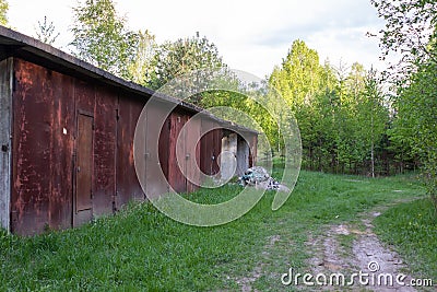 old abandoned garages and a lot of junk Stock Photo