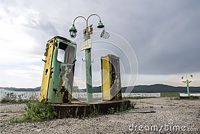 Old and abandoned gas station on a forgotten highway, a mystical and gloomy atmospheric place dramatic sky Stock Photo