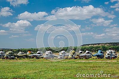 Old abandoned helicopters, broken non-working helicopters, cemetery of old helicopters Stock Photo