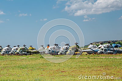 Old abandoned helicopters, broken non-working helicopters, cemetery of old helicopters Stock Photo