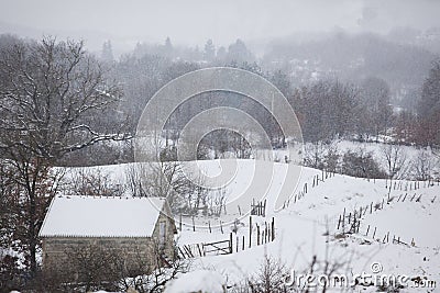 Old abandoned house in the mountain under the snow Stock Photo