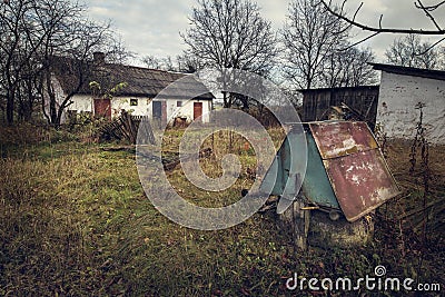 Old abandoned house in the village. Rustic destroyed home in the countryside farm. Stock Photo