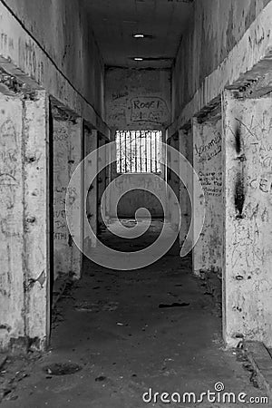 Old abandoned prison hall window bars jail Stock Photo