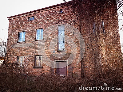 Old abandoned red brick house facade decay abstract Stock Photo